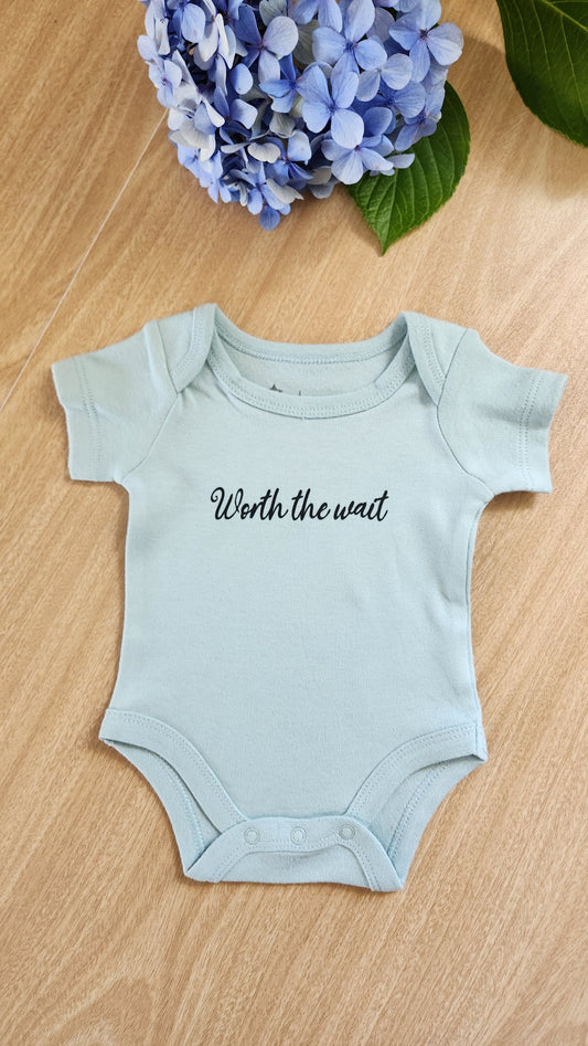 'Worth the wait' baby onesie