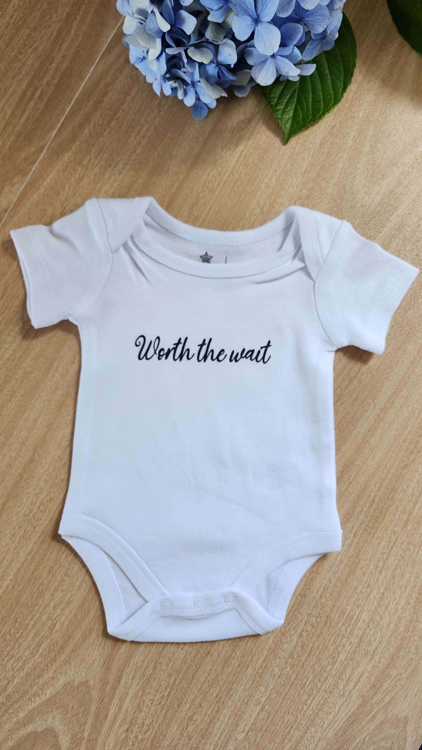 'Worth the wait' baby onesie